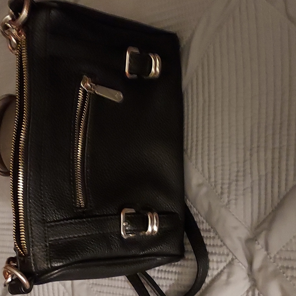 black pocketbook with gold buckles